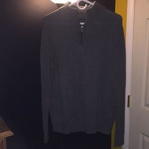 Quarter-zip sweater.